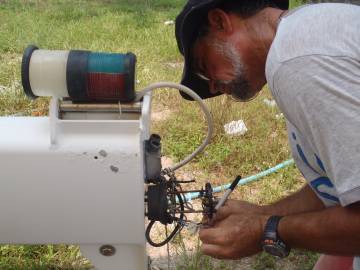 Jon removing bits from the top of Ocelot's mast