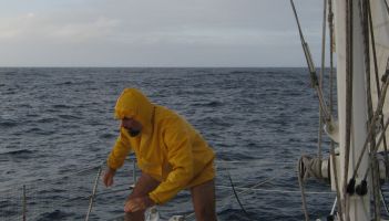 Jon returns from reefing the mainsail in a squall