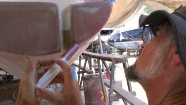 Jon injecting 60cc of phenolic epoxy into our starboard transom