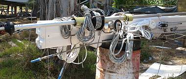 Ropes, wires, & rigging all tied up at the base of the mast