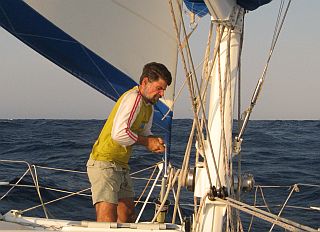 Jon reefing the main - note reefed jib