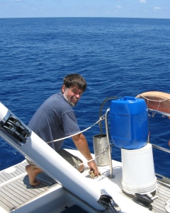 Jon refuels with diesel while at sea.