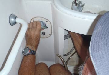 Jon removing water-control valves from the bathrooms