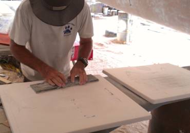 Sanding the filler on the chain-locker hatches