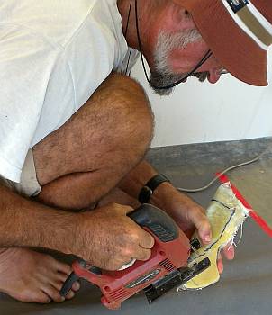 Trimming off the excess glass with a jig-saw