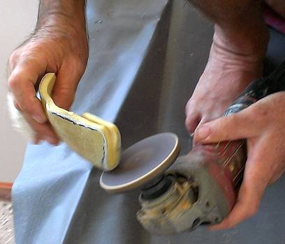 Final shaping and rounding of the sharp edges with a sanding grinder