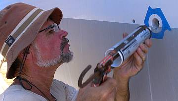 Jon installing the last of the waterline vents