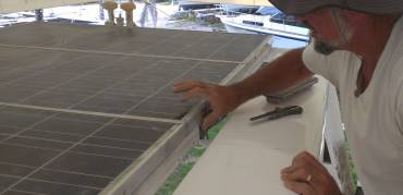 Preparing to remount the solar panels to the targa-bar