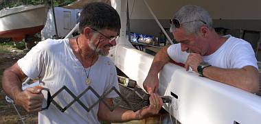 Jon and Werner pop-riveting mast steps to the mast