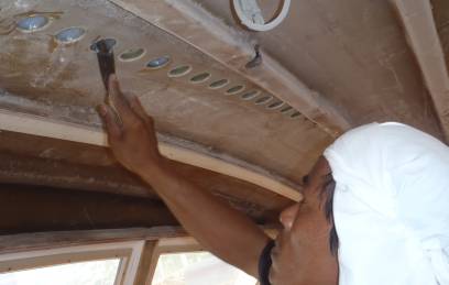 Kao filling decoring holes for the sail-track in the salon ceiling