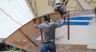 Baw & Lek shaping the foam for the outer wall of stbd extension