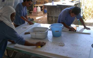 Lek, Jack & Nut sanding the parts that were sprayed yesterday