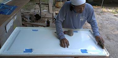 Lek sanding the gasket surface of a big cockpit hatch