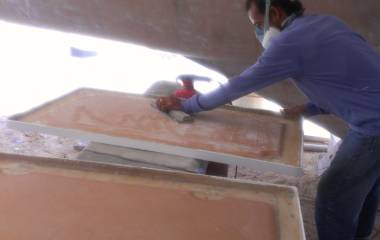 Lek hand sanding the underside of our big cockpit hatches