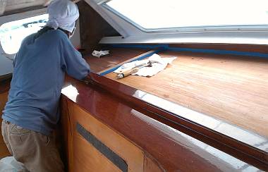 Lek sanding the big shelf on the starboard side of the salon