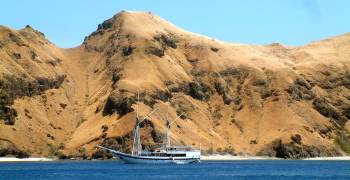 Local live-aboard dive-boat anchored at Banta