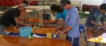 The sanding crew, hard at work under Ocelot's bows