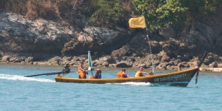 Even monks get around in long-tail boats