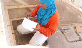 Mee epoxying the shelves into the starboard sugar-scoop