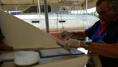 Mike screeing on some epoxy filler to flatten the sugar-scoops