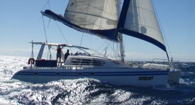 Jon and I sailing Ocelot at 8 knots, Madagascar