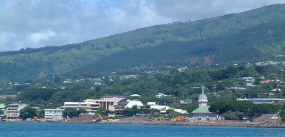 The Papeete waterfront, from near the pass, shows the built-up hills.