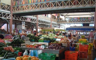 The vast two-story Papeete market sells fruits, veg, prepared foods, handicrafts.