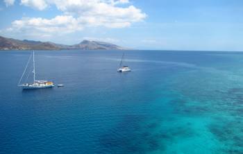 Cruising boats anchored near Kroko Atoll