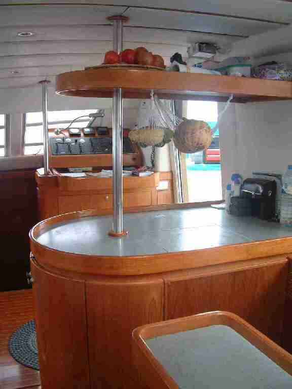 Newer top-opening fridge, with teak replacing the old door