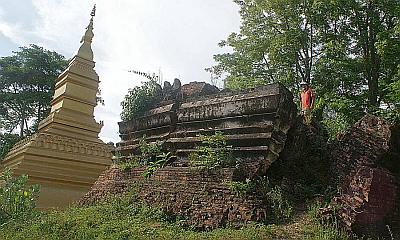 The bombed out stupa next to the new golden stupa