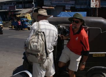 Jon climbs out of a tuk-tuk, Port Blair