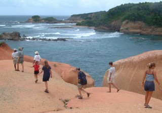 Walking on the clay-like Red Rocks on Dominica's windward side