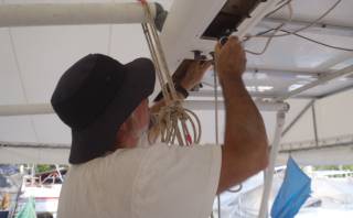 Jon removes the mainsail track from the targa bar