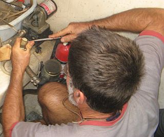 Jon repairing the engine-room bilge pump