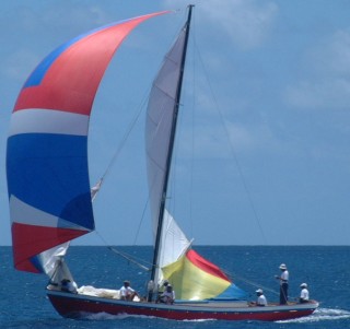 Note the colorful "water sail" under the boom of the mainsail