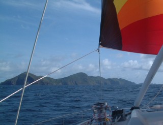 Under spinnaker south of St. Vincent, with Bequia ahead