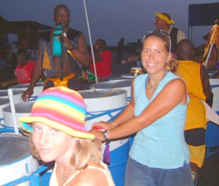 Pushing steel drums (and their players) through Grenada's streets at night