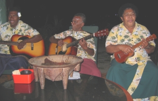 The Bekana band, with their kava bowl in front