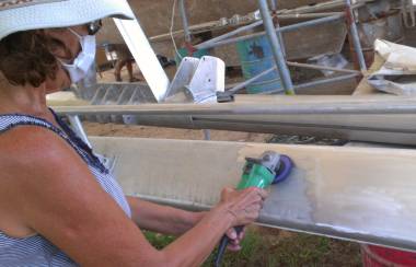 Sue rough-polishing the remaining side of the boom