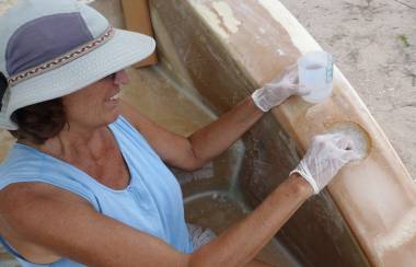 Filling reinforcement holes in the sugar-scoop wall with fiberglass