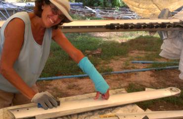 Sue sanding a spreader with her good arm