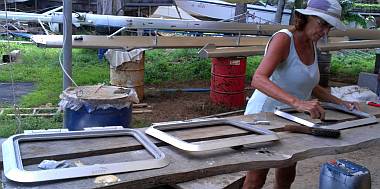 Sue scrubbing silicone out of the hatch-rims