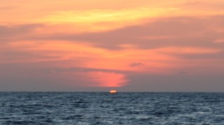 Sunset at sea, just before a green flash