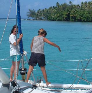 Amanda pointing to the anchor for the helm