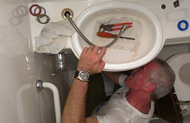 Werner installing the hoses for the faucet/showers