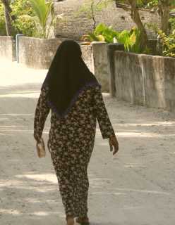 Woman in traditional robe and scarf