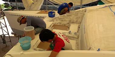 Heru, Yando and Ben sanding Ocelot's foredeck