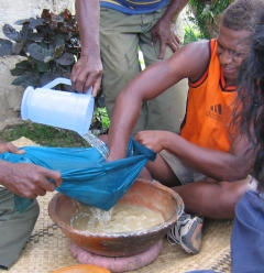 Ground yagona is filtered through a cloth and mixed with water to create the drink