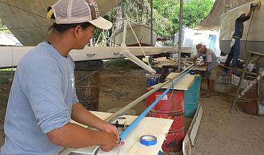 Heru & Jon running wires & rope-pulls through the PVC conduit