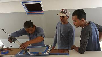 Gooping up the portside emergency hatch window